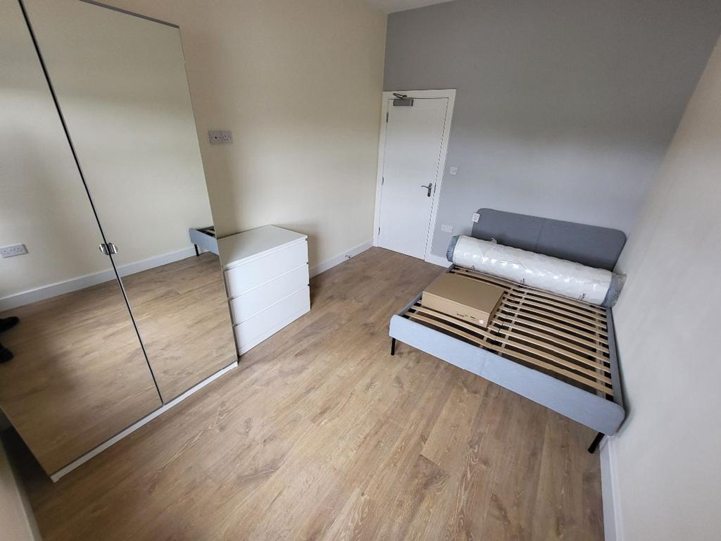 Spacious double bedroom featuring modern decor ...