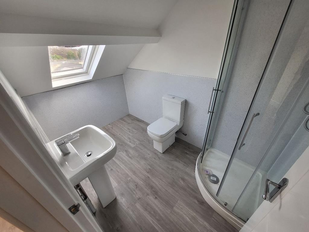 Modern bathroom featuring a sleek shower and co...
