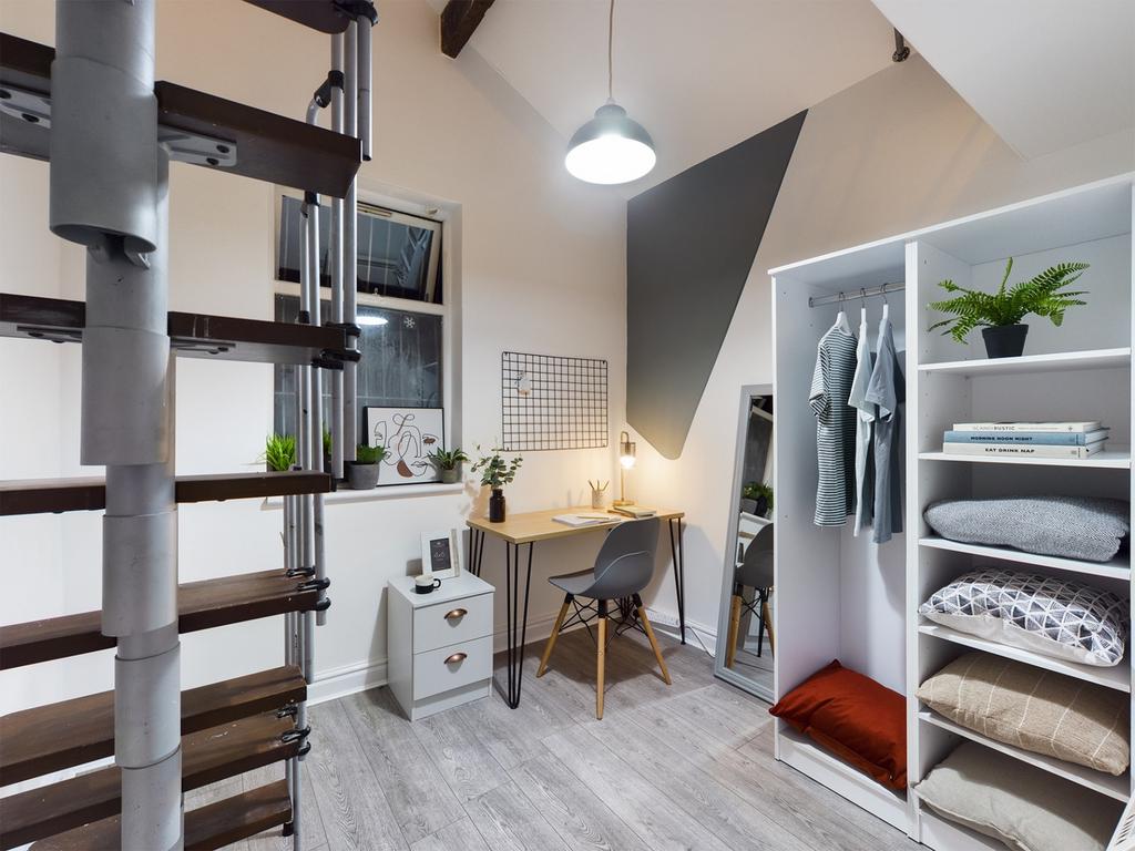 A stylish and tidy double bedroom featuring a s...