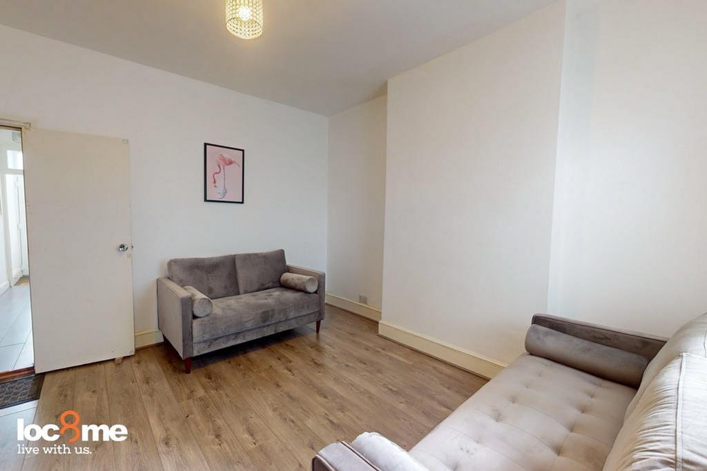 A bright and inviting living room with ample sp...
