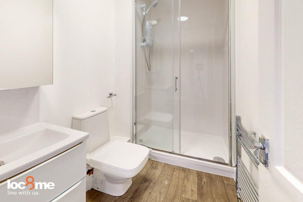 A modern and clean bathroom featuring a sleek s...