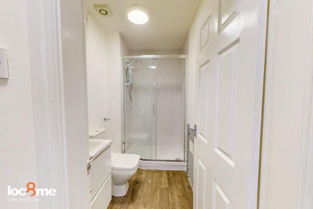 A modern and well-maintained bathroom featuring...