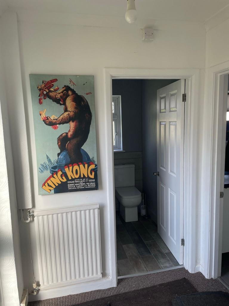 A stylish hallway featuring a vibrant King Kong...