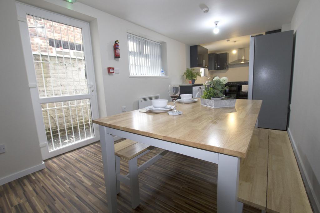 A bright and inviting kitchenette with modern f...