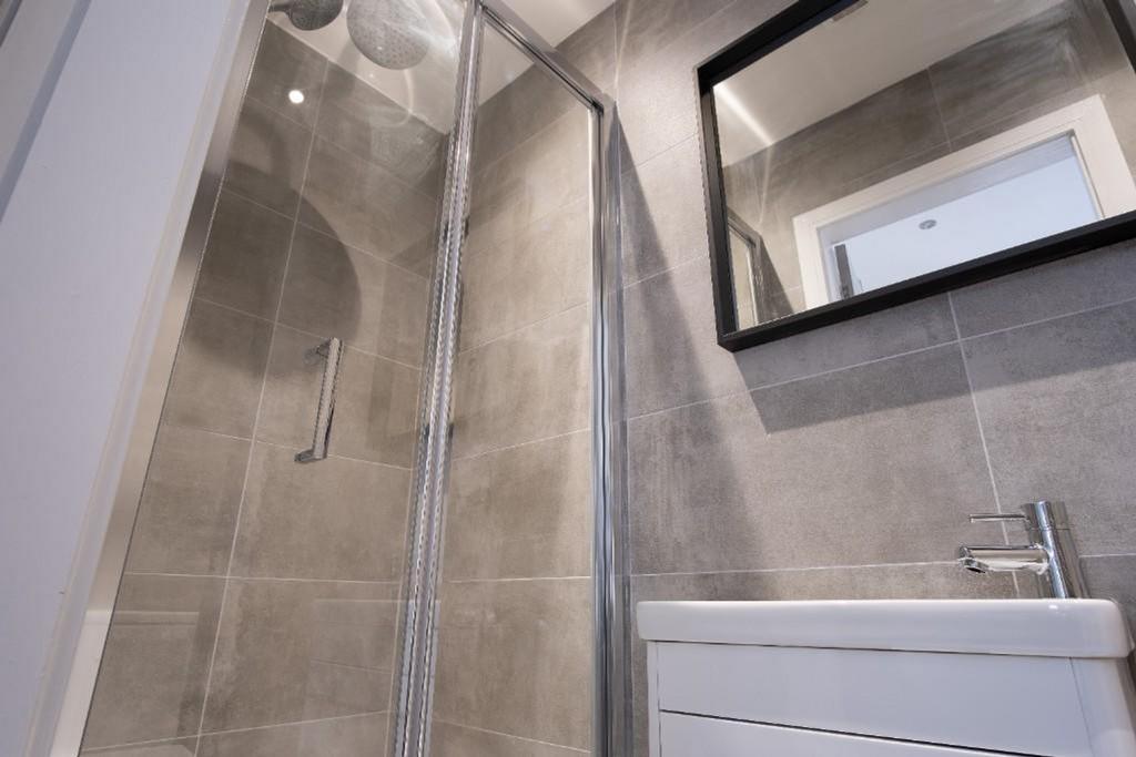 A modern bathroom featuring sleek fixtures, a s...