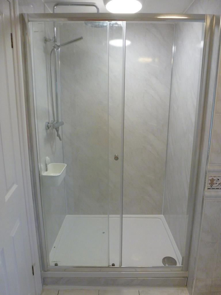 Bright and modern bathroom featuring a spacious...