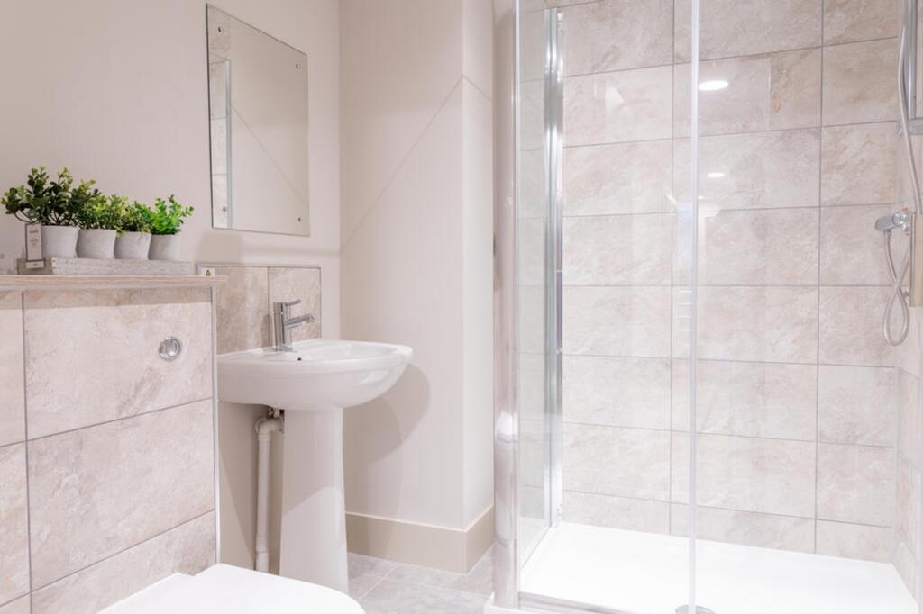 A modern bathroom featuring a sleek design with...