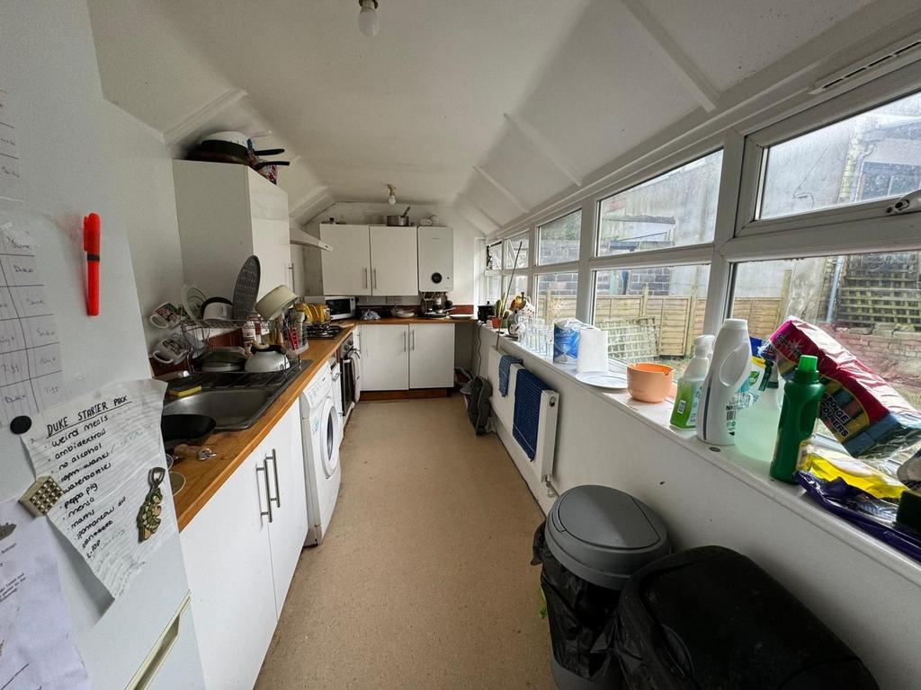 Spacious kitchen featuring ample cabinetry and ...