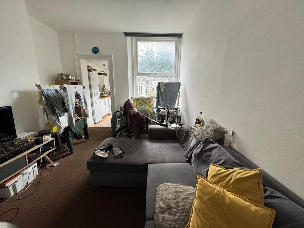 A cozy living room featuring ample seating for ...