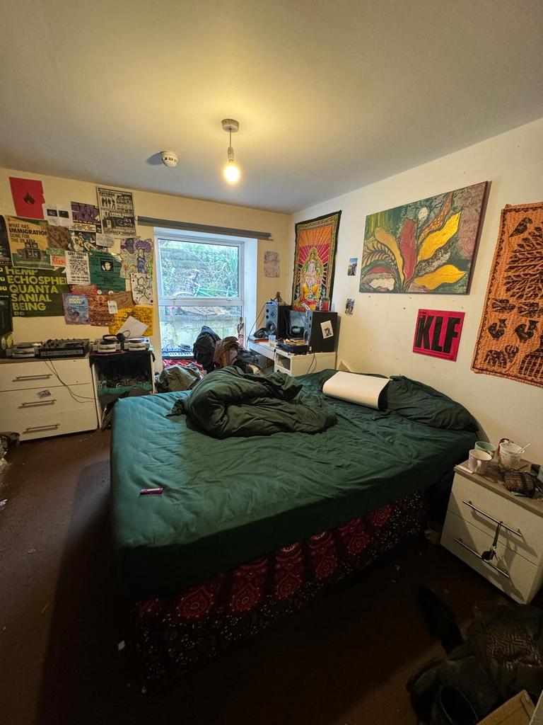 Spacious double bedroom featuring a comfortable...