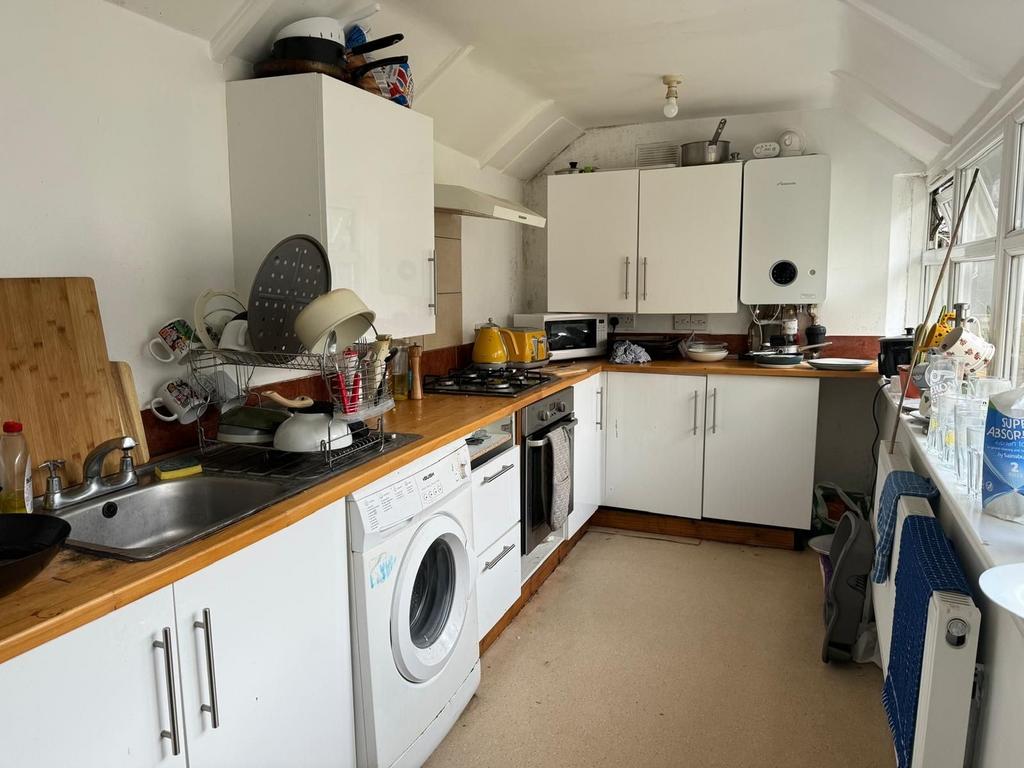 This charming kitchen features ample storage wi...