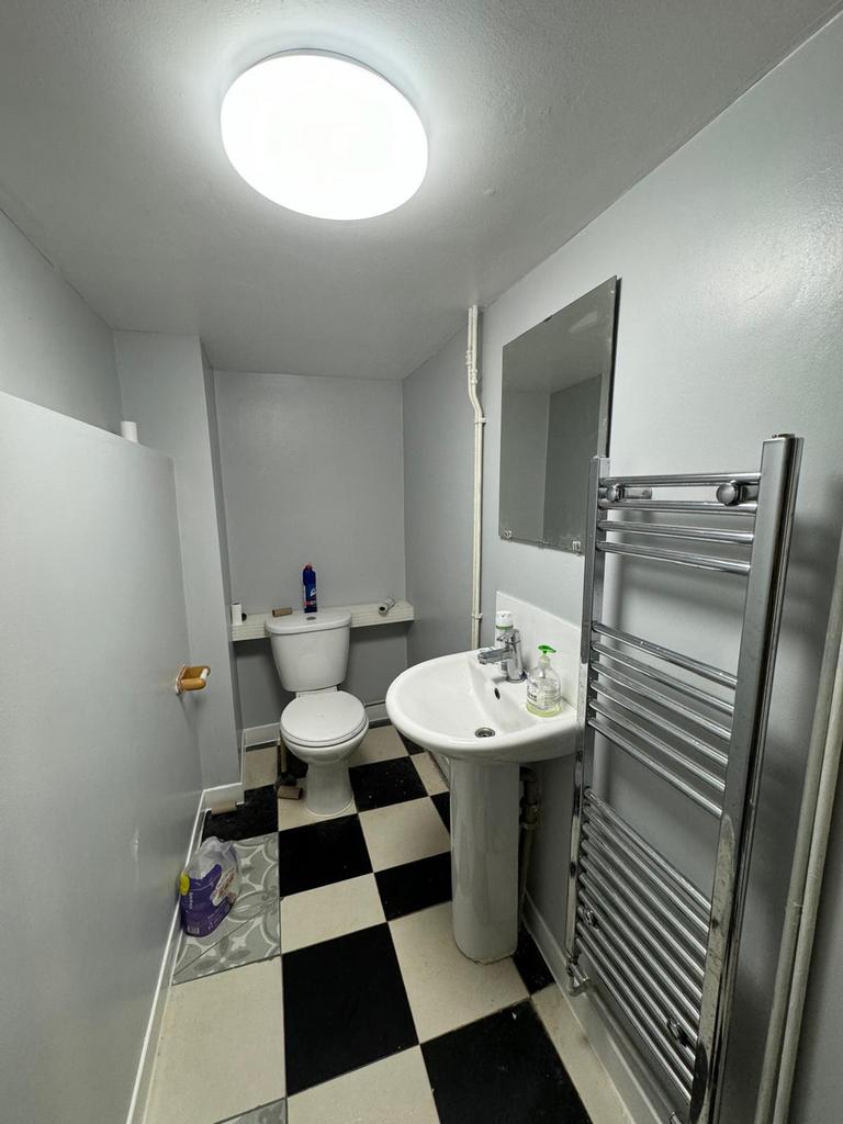 Bright and modern bathroom featuring a sleek de...