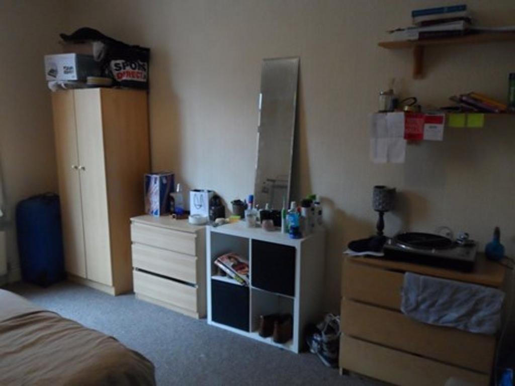 Cozy double bedroom featuring a spacious layout...