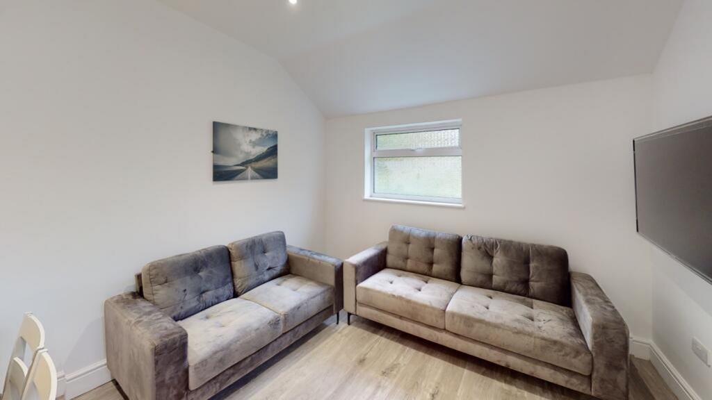A cozy and inviting living room featuring comfo...