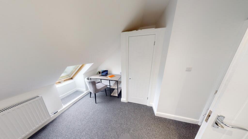 A bright and inviting double bedroom featuring ...