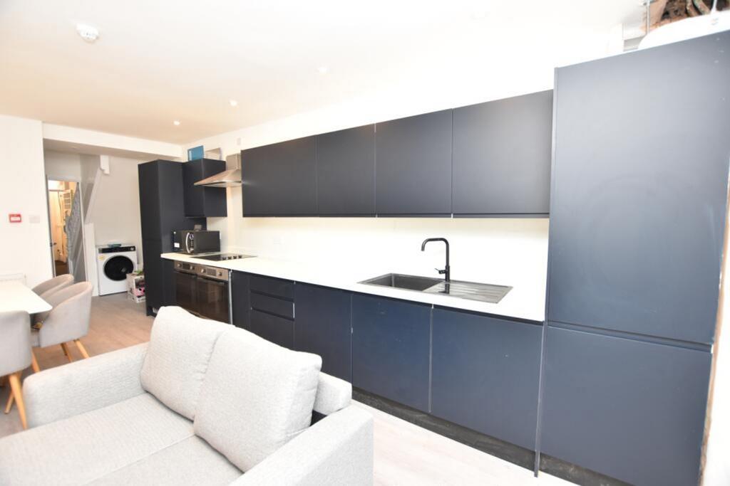 Modern kitchen featuring sleek design with ampl...