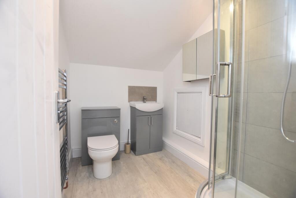 Stylish and modern bathroom featuring a sleek s...