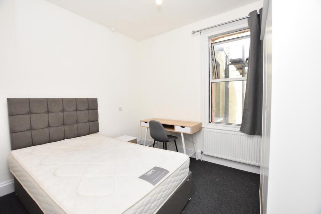Bright and inviting double bedroom featuring a ...