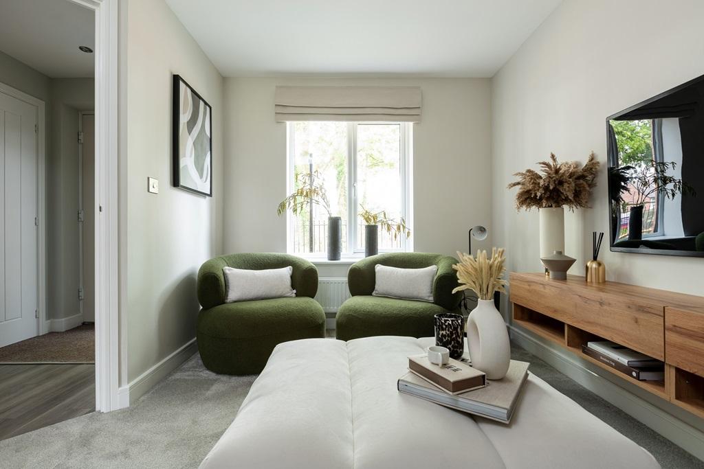 The welcoming &amp; cosy living room is at the...