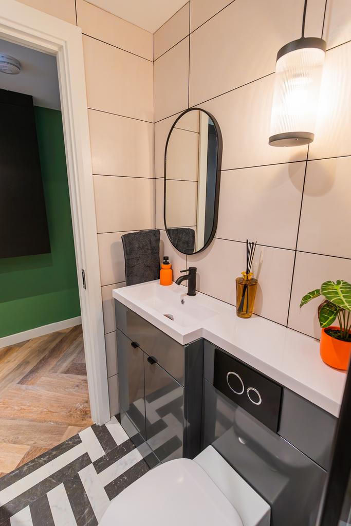 A modern and stylish bathroom featuring sleek f...