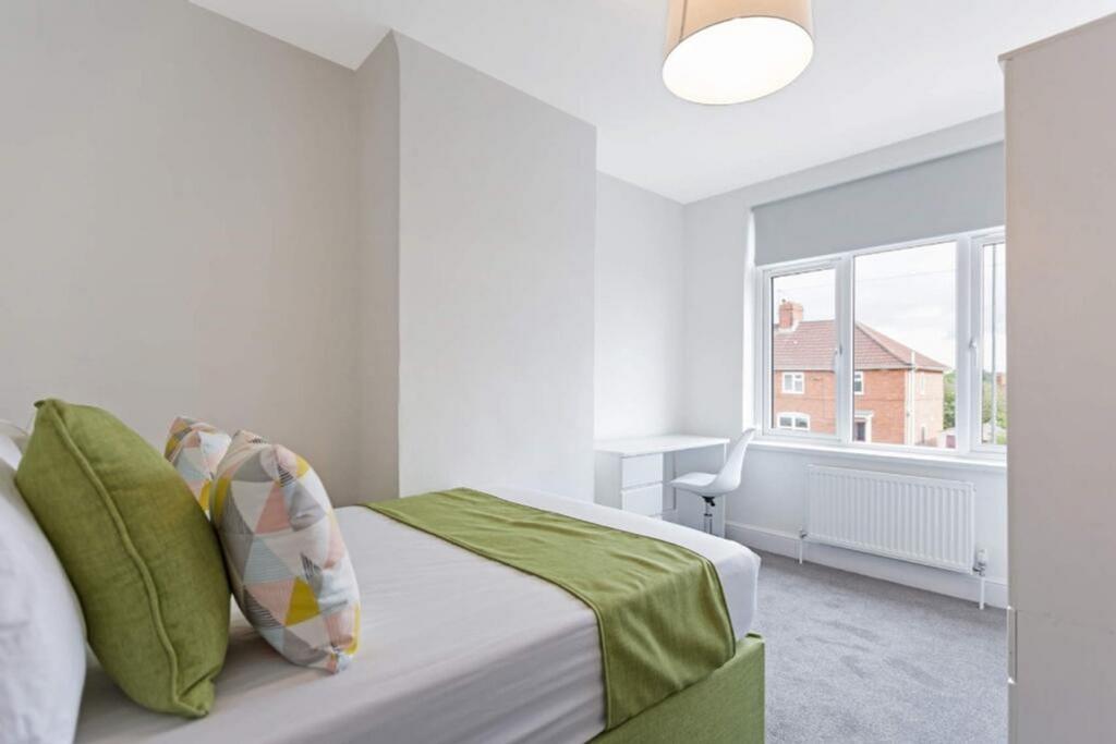 This bright and airy double bedroom features a ...