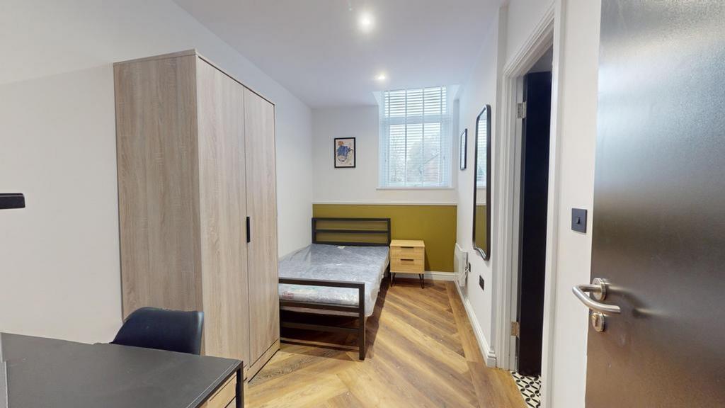 A bright and spacious double bedroom featuring ...