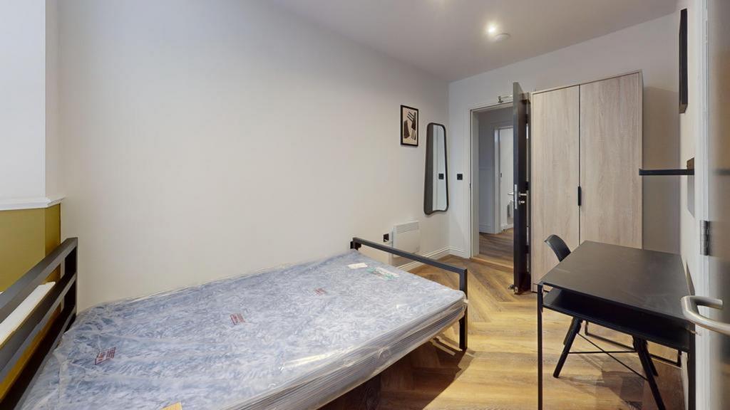 A cozy double bedroom featuring modern decor an...