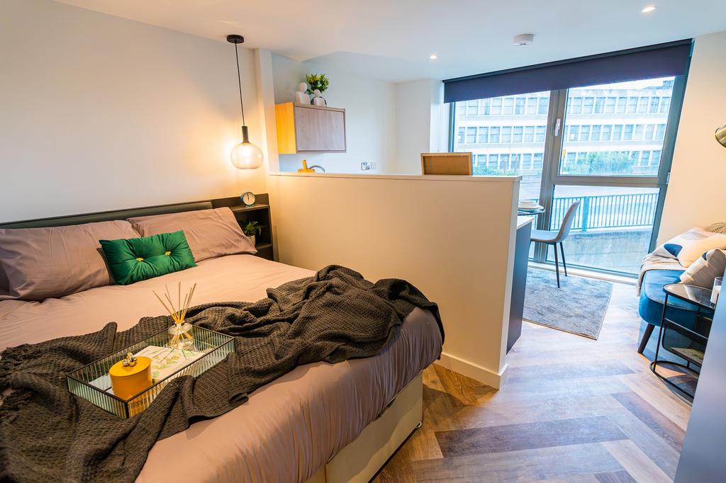 A spacious and well-lit large double bedroom wi...