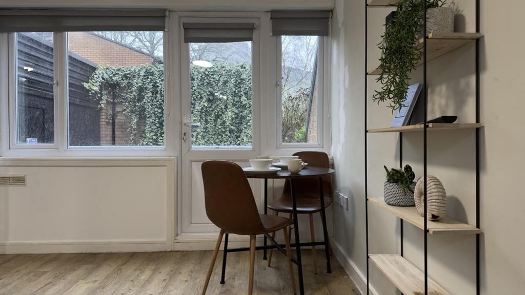 A bright and clean kitchenette with modern deco...