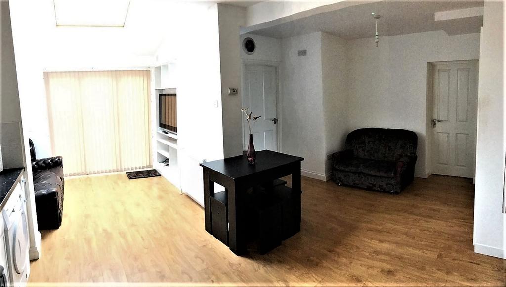Spacious living area with ample natural light, ...
