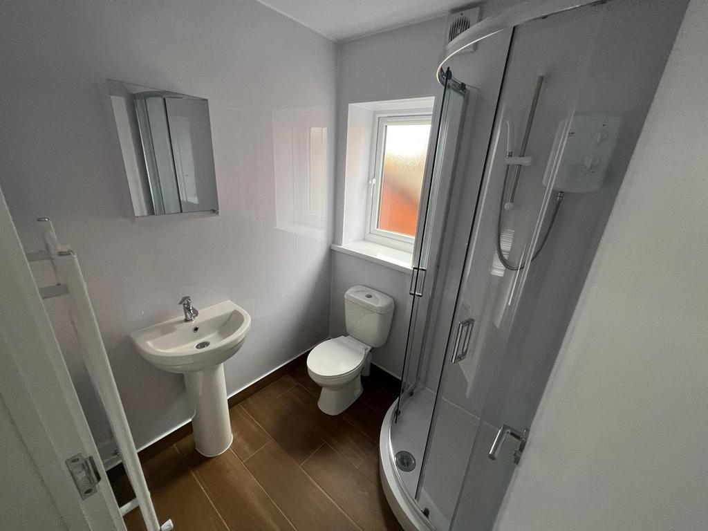Bright and modern bathroom featuring a sleek sh...