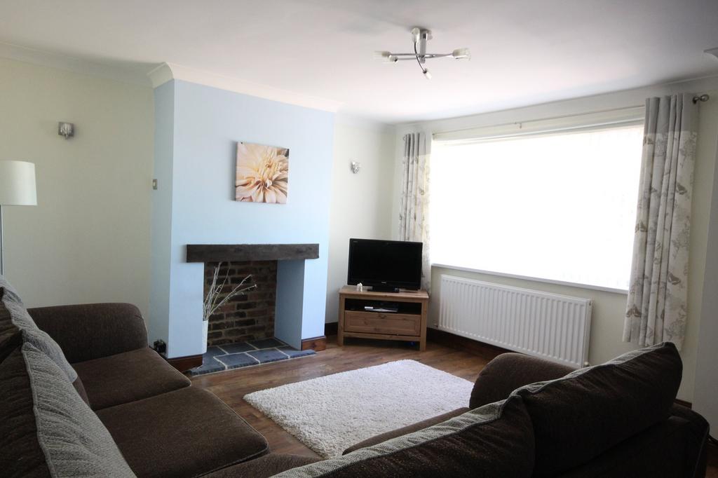 This inviting living room features a cozy seati...