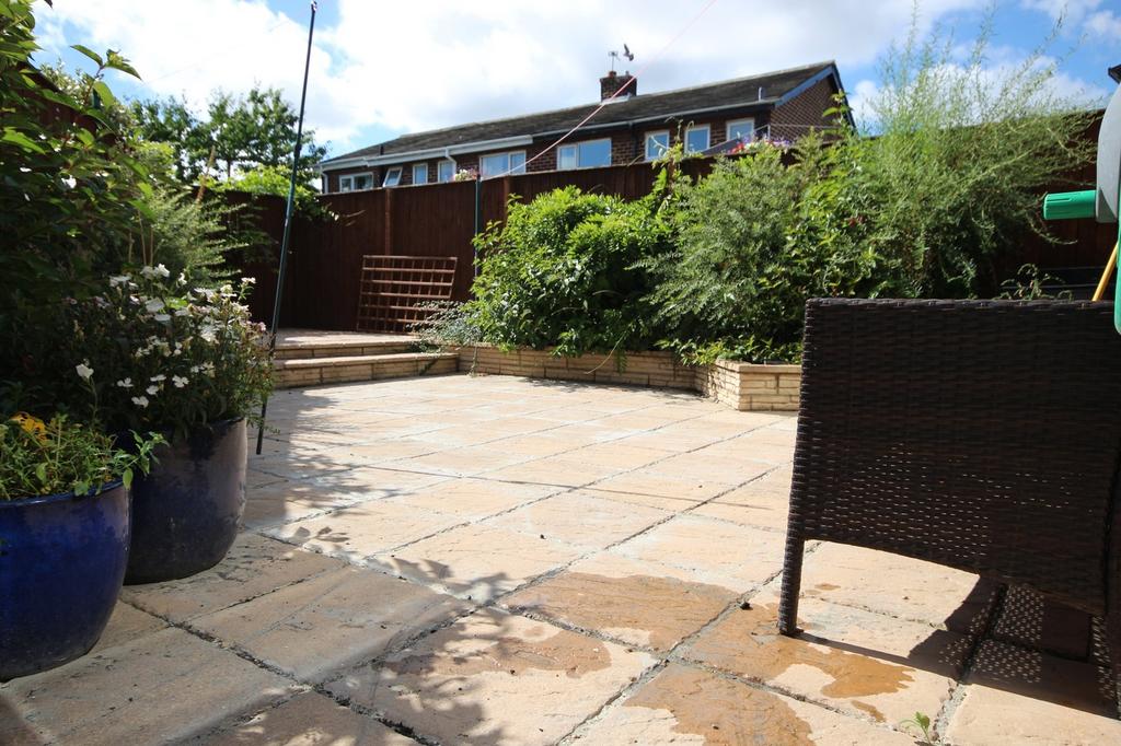 A beautifully maintained garden space featuring...