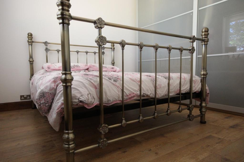 Charming double bedroom featuring a stylish met...