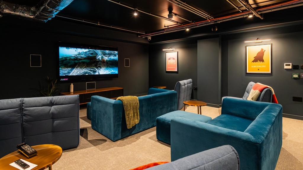 A stylish and cozy cinema room perfect for movi...