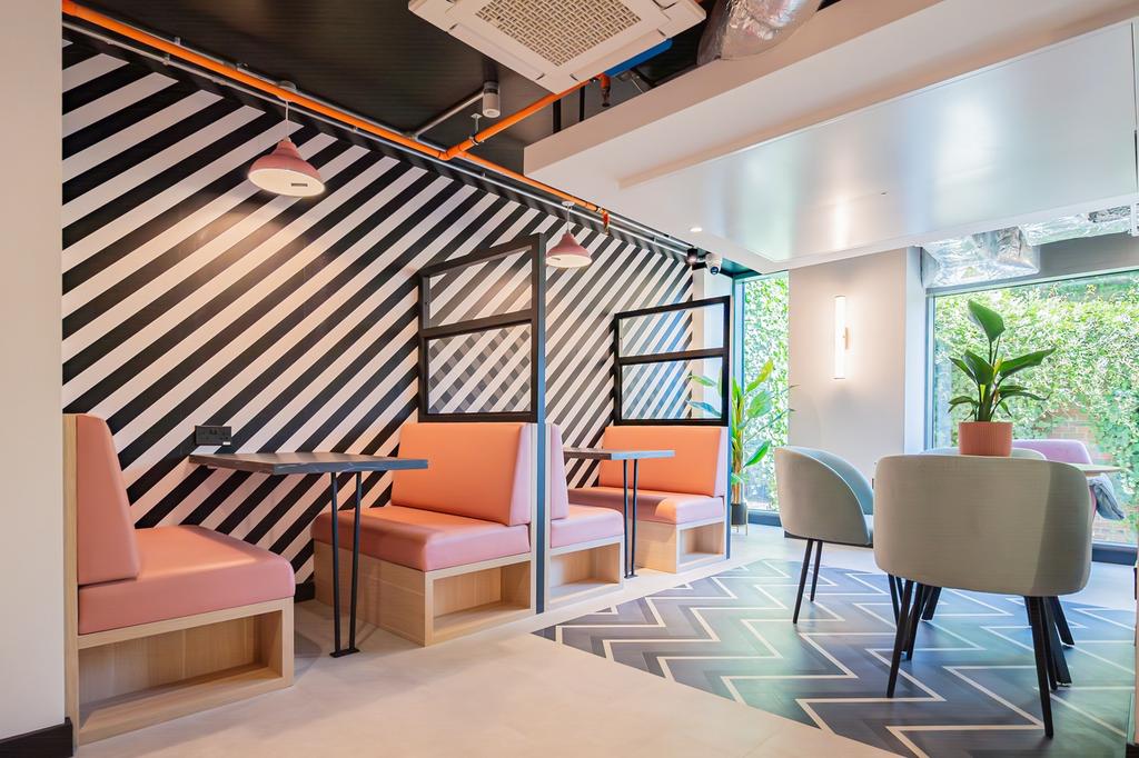 A vibrant and inviting communal lounge with mod...
