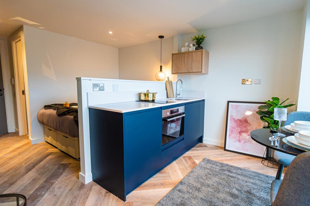A beautifully designed kitchenette with modern ...