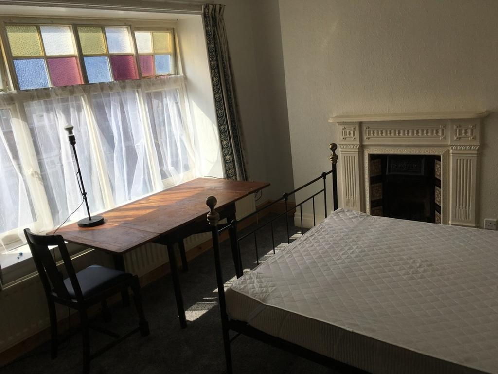 This charming double bedroom features ample nat...