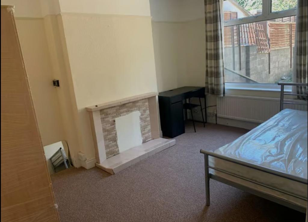 A bright and spacious double bedroom featuring ...