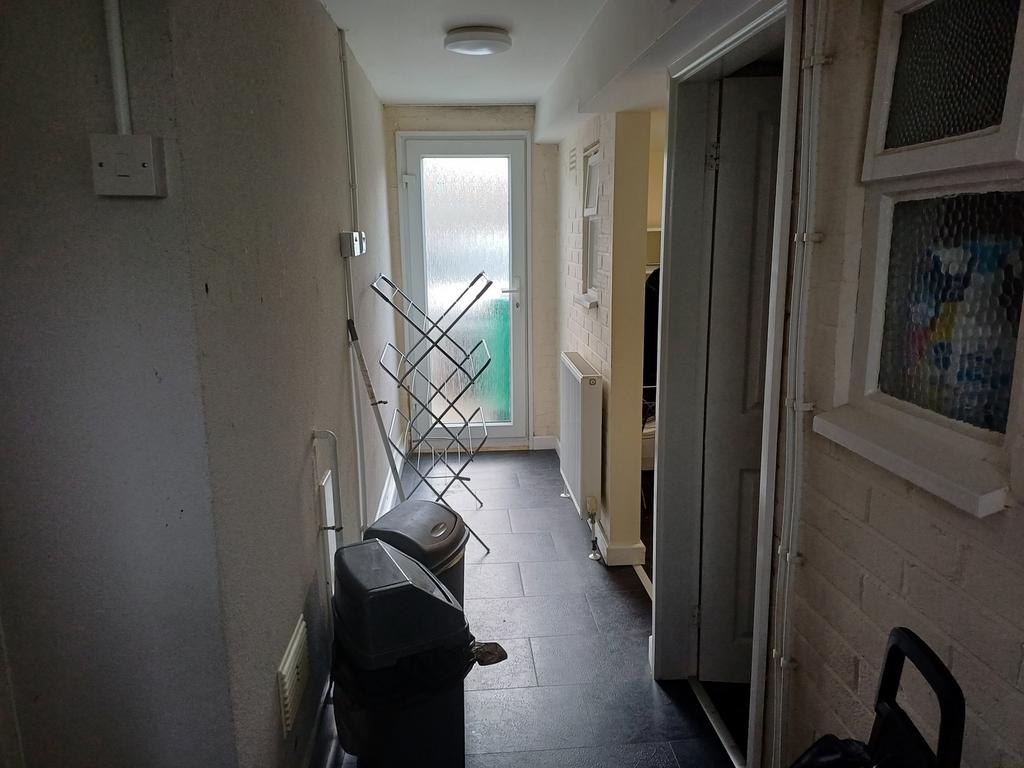 A well-maintained hallway featuring ample natur...