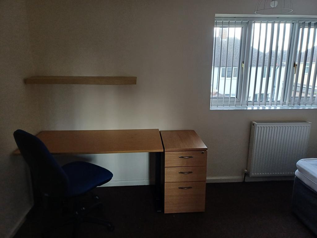 This double bedroom offers a cozy and practical...