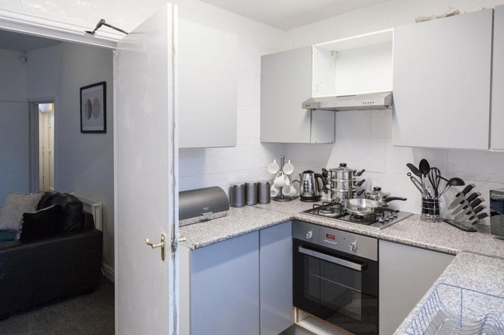 This modern kitchen features sleek cabinetry an...