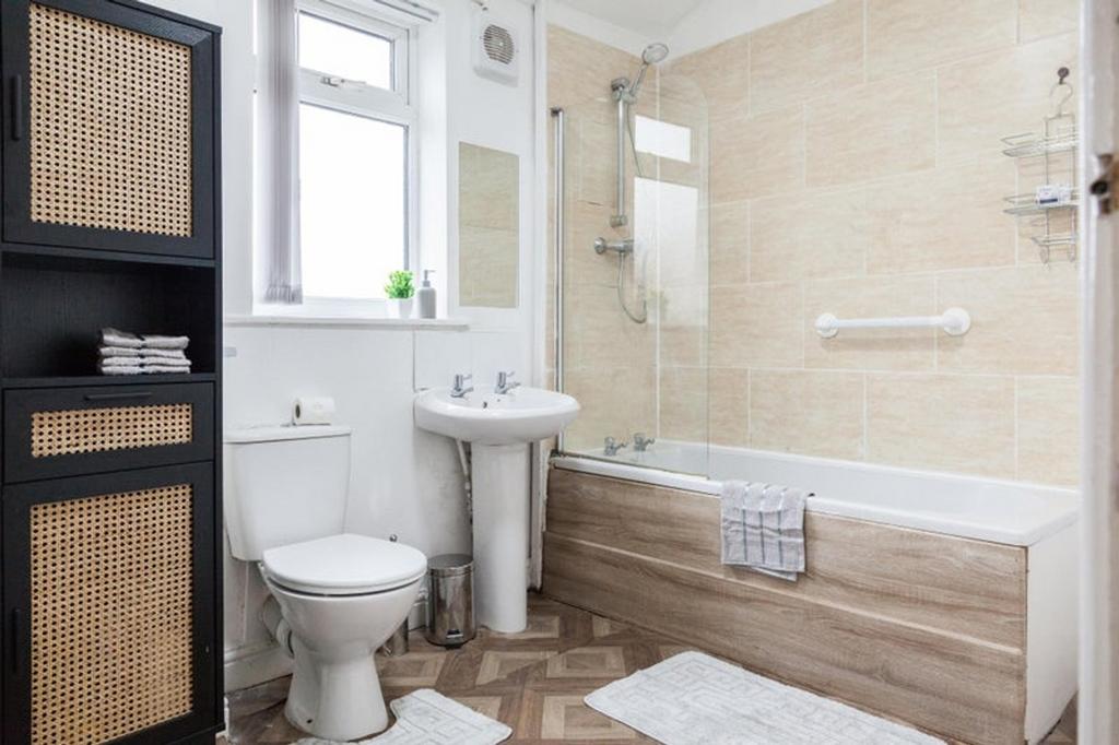 This modern bathroom features a clean design wi...