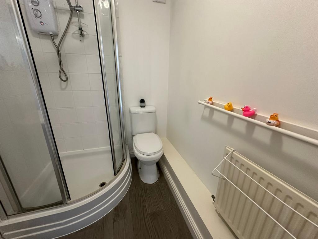 This modern bathroom features a sleek shower en...
