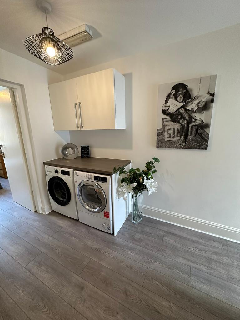 A stylish and modern kitchen area featuring int...