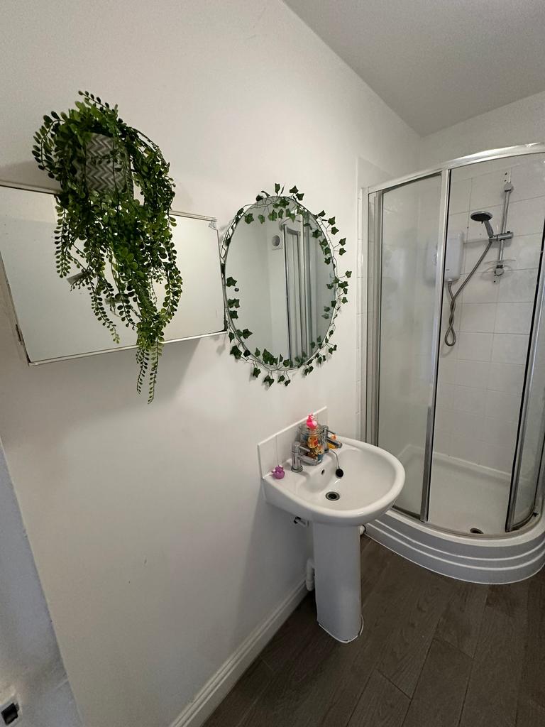 A bright and modern bathroom featuring a stylis...