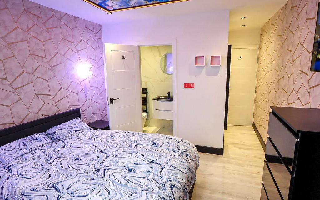 A stylish and inviting double bedroom featuring...