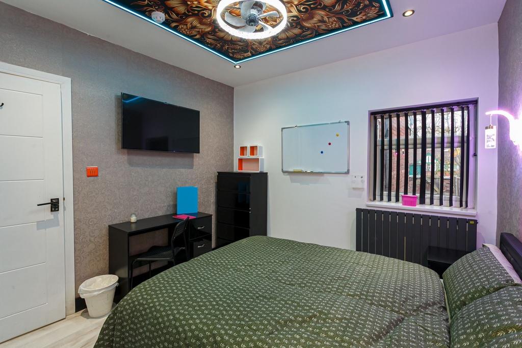 A stylish double bedroom with modern decor, per...