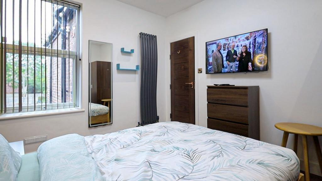 A bright and inviting double bedroom featuring ...