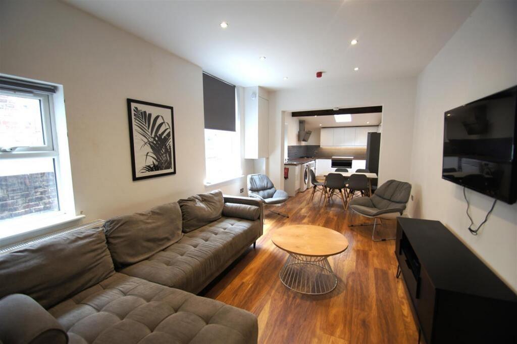 This contemporary living room features spacious...